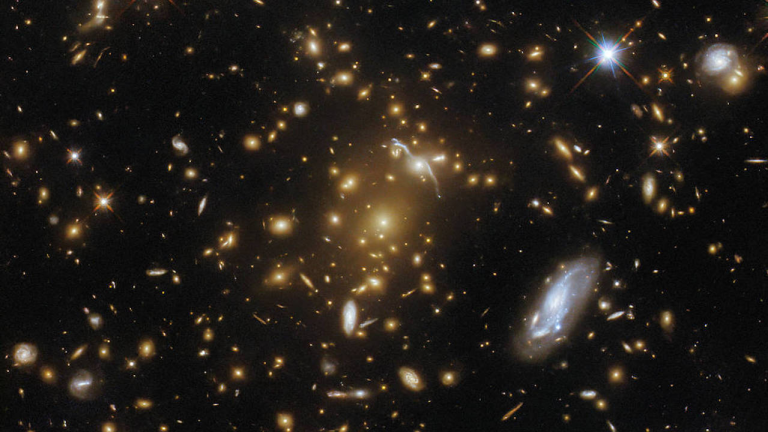Hubble Captures A Light-Bending Galaxy Cluster eMACS J1823.1+7822